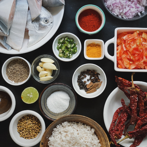 Traditional Goan fish curry ingredients with coconut and spices